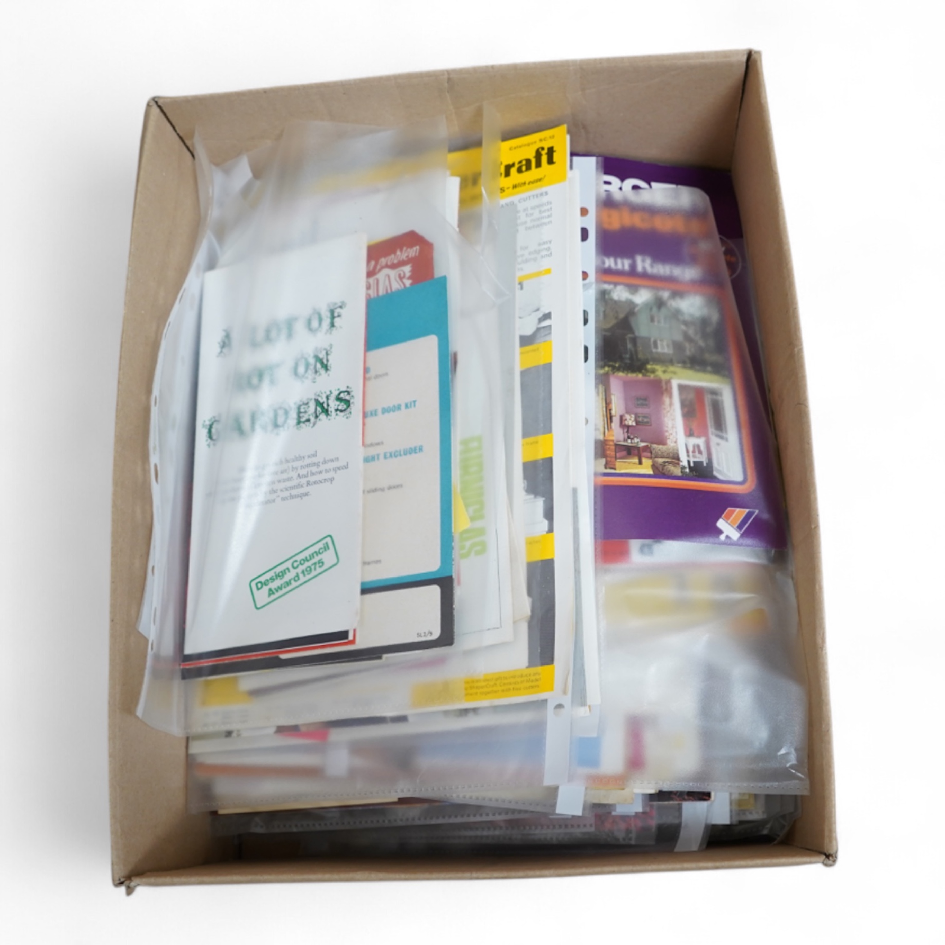 A collection of 1970s advertising booklets for G Plan, Ladderax, Qualcast, Pyrex, etc.